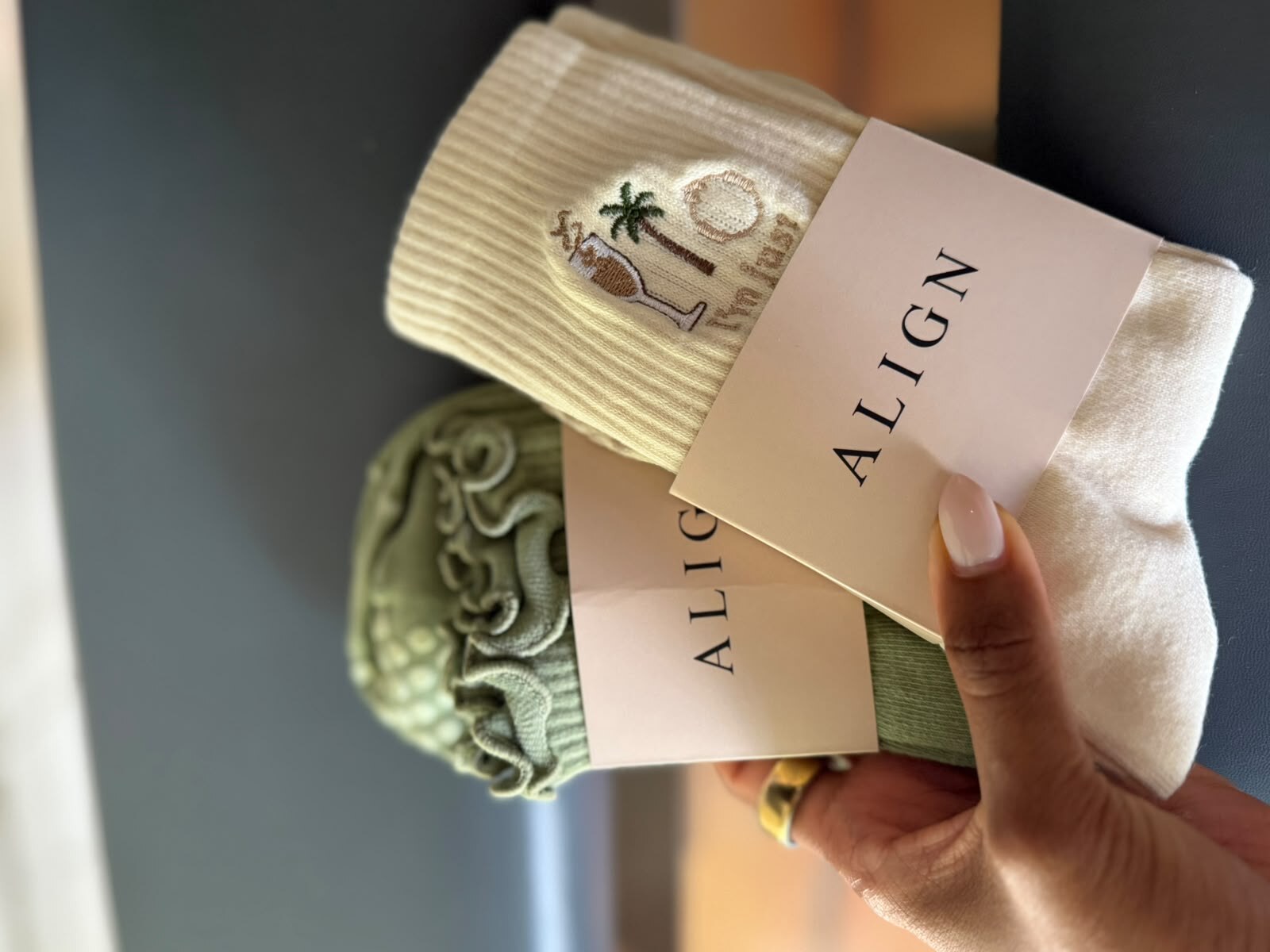 Cream and sage Align grip socks held with branded cards